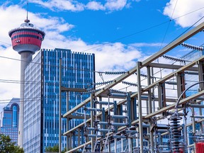 Enmax power lines are seen against the backdrop of the Calgary skyline on Tuesday, August 16, 2022.