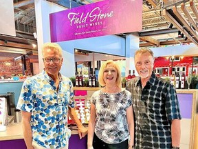 (L to R) Partner Lynden Gill and owners of Field Stone Fruit Wines, Elaine and Marvin Gill, in their booth at the new Calgary Farmer's Market West.