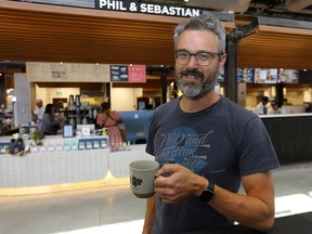 Vendor Phil Robertson of Phil and Sebastian Coffee at the Calgary Farmers' Market during the exclusive opening of the market's second location, CFM West, located at 25 Greenbriar Drive NW in Calgary on Thursday August 11, 2022.