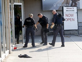 Calgary police investigate a fatal shooting at the Ambassador restaurant in Calgary on Sunday, August 21, 2022.