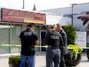 Calgary police investigate a fatal shooting at the Ambassador restaurant in Calgary on Sunday, August 21, 2022. 
