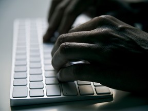 young man typing in a computer keyboard - stock photo, Getty Images