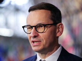 Polish Prime Minister Mateusz Morawiecki speaks to the media in Brussels, Belgium May 31, 2022. REUTERS/Johanna Geron/File Photo