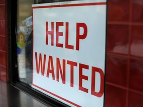 FILE PHOTO: A help wanted sign is posted at a taco stand in Solana Beach, California, US, July 17, 2017. REUTERS/Mike Blake/File Photo ORG XMIT: FW1