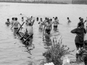 Here, festival goers take a dip in “the pond” at the Woodstock Music Festival. The festival site, a New York state farm, was transformed by idealistic youths into a mid-size city in a celebration of rock music and utopian ideals. Annie Birch photo; AFP/Getty Images.