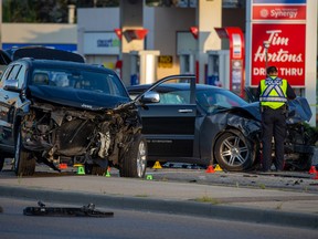 Calgary police investigate a serious early morning collision involving three vehicles at the intersection of Edmonton Trail and 16th Avenue N.E. on Friday, August 26, 2022.