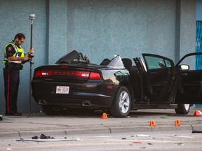 A Dodge Charger is pictured without its roof after a collision occurred at the intersection of Edmonton Trail and 16th Avenue N.E. on Friday, August 26, 2022.