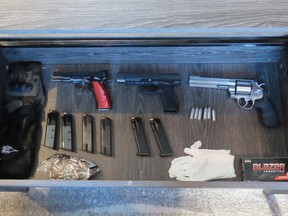 Calgary police seized three handguns and drugs with an estimated street value of $460,000 from two homes in Aspen Woods and Temple on Tuesday, Aug. 30, 2022.