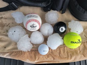 Photos of the large hail which fell in the Innisfail area on Monday evening, Aug. 1.