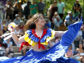 Dancer Jackie Garcia from the Asi Es Colombia Cultural Association performs during Heritage Day festivities at Olympic Plaza in Calgary on Monday, August 1, 2022. Darren Makowichuk/Postmedia