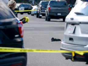 A pair of shoes are pictured at the scene where a body was found in the middle of the street on 18th Ave. and Victoria Crescent N.W. on Thursday, August 25, 2022.