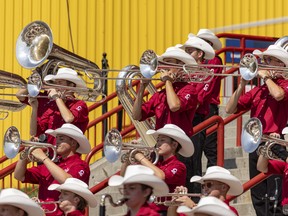 The Stampede Showband performs on the steps of the Scotiabank Saddledome at the Calgary Stampede on Saturday, July 10, 2021.