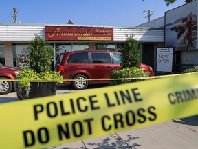 Police investigators on the scene of a homicide at the Ambassador Restaurant and Bar on Monday, Aug. 22, 2022.