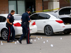 Calgary police investigate another shooting in a parking lot of a strip mall on  28th St. S.E. near Radcliffe Drive S.E. in Calgary on Tuesday, August 23, 2022.