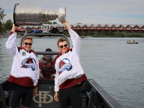 2022 Stanley Cup champions Logan O’Connor and Cale Makar with the Colorado Avalanche bring the Cup to Calgary for a boat ride up the Bow River on Tuesday, August 9, 2022. Al Charest / Postmedia