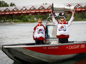 2022 Stanley Cup champions Logan O’Connor and Cale Makar with the Colorado Avalanche bring the Cup to Calgary for boat ride up the Bow River on Tuesday, August 9, 2022. Al Charest / Postmedia
