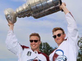 2022 Stanley Cup champions Logan O'Connor and Cale Makar with the Colorado Avalanche bring the Cup to Calgary for boat ride up the Bow River on Tuesday, August 9, 2022. Al Charest / Postmedia
