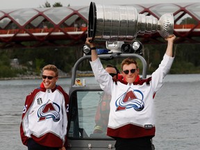 2022 Stanley Cup champions Logan O’Connor and Cale Makar with the Colorado Avalanche bring the Cup to Calgary for boat ride up the Bow River on Tuesday, August 9, 2022. Al Charest / Postmedia