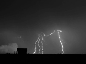 Lightning lights up the sky southeast of Calgary, Alta south of Carseland, Alta on Sunday July 3, 2016. Southern Albertans have been treated to some spectacular light shows with many electrical storms running through the province. Jim Wells//Postmedia