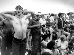 In this Aug. 16, 1969 file photo, rock music fans relax during a break in the entertainment at the Woodstock Music and Arts Fair in Bethel, N.Y. Woodstock was many things but one thing is clear — it is revered by many as the cultural touchstone of a generation. AP photo, Postmedia files.