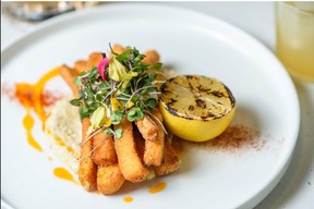 Strips of tender calamari with artichoke-lemon tartar sauce is one appetizer at Luca. Azin Ghaffari/Postmedia