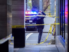 Calgary police investigate a stabbing at a downtown CTrain station on Oct. 15, 2021.