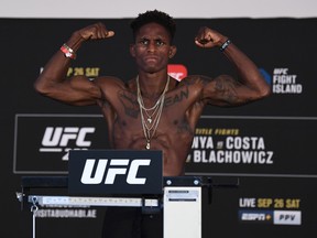 In this handout image provided by the UFC, Hakeem Dawodu of Calgary poses on the scale during the UFC 253 weigh-in on September 25, 2020, at Flash Forum on UFC Fight Island, Abu Dhabi, United Arab Emirates.