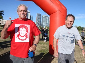 Bret Hart (L) pumps his fist at the start of the Terry Fox Run held at Fort Calgary in downtown Calgary on Sunday, September 18, 2022.