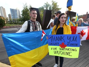 Members of Calgary's Ukrainian community gather at 10 Street and Memorial Drive N.W. in Calgary on Sunday, September 18, 2022.