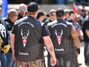 A Soldiers of Odin member stands guard at an anti-Islam rally at Calgary City Hall on Saturday, June 3, 2017. A new report says organized hate groups like the Soldiers of Odin are giving way to more individualized examples. of extremism.