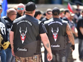 A Soldiers of Odin member stands guard at an anti-Islam rally at Calgary city hall on Saturday, June 3, 2017. A new report says organized hate groups such as the Soldiers of Odin are giving way to more individualized examples of extremism.