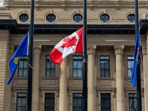 Flags fly at half-mast outside the Government of Alberta offices in Calgary following the death of Queen Elizabeth II on Thursday, September 8, 2022.