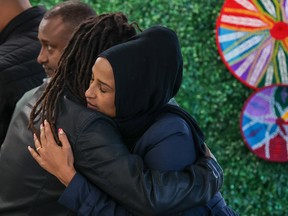 Meron Tesfatsion, right is consoled by a friend at a memorial for her brother Temesgen on Tuesday, September 20, 2022. Temesgen was killed in a restaurant shooting on August 21. Police believe the shooting was targeted, but that Tesfatsion was an innocent victim and not the intended target.Gavin Young/Postmedia