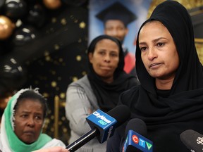 Meron Tesfatsion speaks at a memorial for her brother Temesgen with her mother and other siblings behind her on Tuesday, September 20, 2022. Temesgen was killed in a restaurant shooting on August 21. Police believe the shooting was targeted, but that Tesfatsion was an innocent victim and not the intended target.