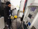 Jatinder Bal fills his semi-truck with over 500 liters of diesel at an Esso station on 32nd Street NE ahead of a trip to Utah on Thursday, September 22, 2022. Relaxed oil prices have prompted the Alberta government to partially reinstate the tax provincial government to fuel, as of October 1.