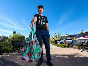 Robert Tremblay with the Calgary Climate Hub carries his shopping in a reusable bag in Quarry Park on Monday, September 26, 2022.