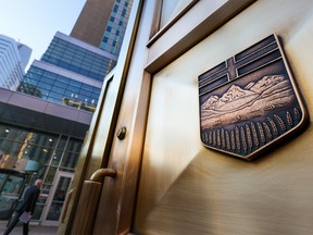 The brass doors are shown outside the Calgary Courts Centre.