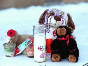 A small collection of items are shown at the scene in northwest Calgary on Tuesday, January 2, 2018 a short distance from where a newborn baby girl was found deceased on Christmas Eve
