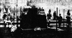 Guards are shown standing silent and motionless in Westminster Hall, guarding the body of King George as he lay in state.  Calgary Herald;  February 16, 1952.
