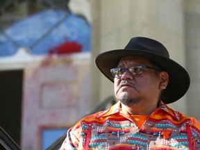 Rev Tony Snow, from the Stoney Nakoda Nation, speaks to a small gathering on the front steps at Grace Presbyterian Church on 15 Ave SW in Calgary on Sunday, September 25, 2022 during a Ceremony and Prayer for Red Paint Painted Over, an Indigenous-led Ceremony and Prayer.