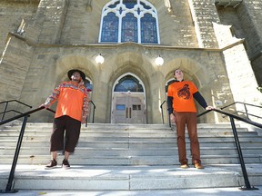 Rev Tony Snow, from the Stoney Nakoda Nation,  and Jake Van Pernis, Associate Minister of Engagement and Service, pose at Grace Presbyterian Church on 15 Ave SW in Calgary on Sunday, September 25, 2022 during a Ceremony and Prayer for Red Paint Painted Over, an Indigenous-led Ceremony and Prayer.