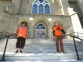 The Rev. Tony Snow of the Stoney Nakoda Nation and Jake Van Pernis, Associate Minister for Engagement and Service, pose at Grace Presbyterian Church on 15 Ave SW in Calgary on Sunday, September 25, 2022 during a red paint ceremony and prayer painted, a ceremony and prayer led by indigenous people.