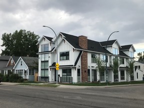 This new row housing is next to two small cottage sized homes in West Hillhurst.