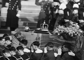 The royal banner covers the coffin of King George VI as it is carried by soldiers at his funeral on February 15, 1952. Getty Images;  George Halles.