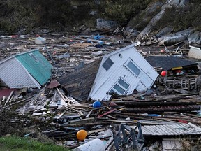 Structures float on water after Post-Tropical Storm Fiona in Rose Blanche, Nfld., on Sunday.