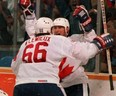 On this day in history in 1987, Team Canada defeated the Soviet Union 6-5 in the third and deciding game of the Canada Cup hockey tournament final in Hamilton. Wayne Gretzky set up Mario Lemieux for the winning goal — one of the most memorable in hockey history. All three games were decided in overtime by 6-5 scores. Pictured, Gretzky and Lemieux celebrate that goal. Canadian Press photo.