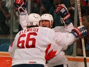On this day in history in 1987, Team Canada defeated the Soviet Union 6-5 in the third and deciding game of the Canada Cup hockey tournament final in Hamilton. Wayne Gretzky set up Mario Lemieux for the winning goal — one of the most memorable in hockey history. All three games were decided in overtime by 6-5 scores. Pictured, Gretzky and Lemieux celebrate that goal. Canadian Press photo.