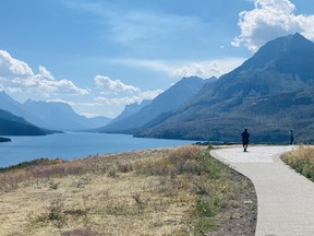 An image of Upper Waterton Lake surrounded by mountains in Waterton Lakes National Park in Alberta, Canada.