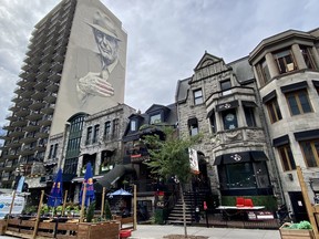 A mural of Leonard Cohen looms over Montreal’s Crescent Street in the Golden Square Mile. Photo, Jody Robbins