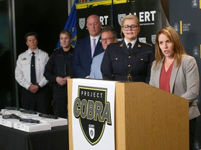Representatives from Canadian and U.S. law enforcement agencies speak at Wednesday’s press conference in Calgary.